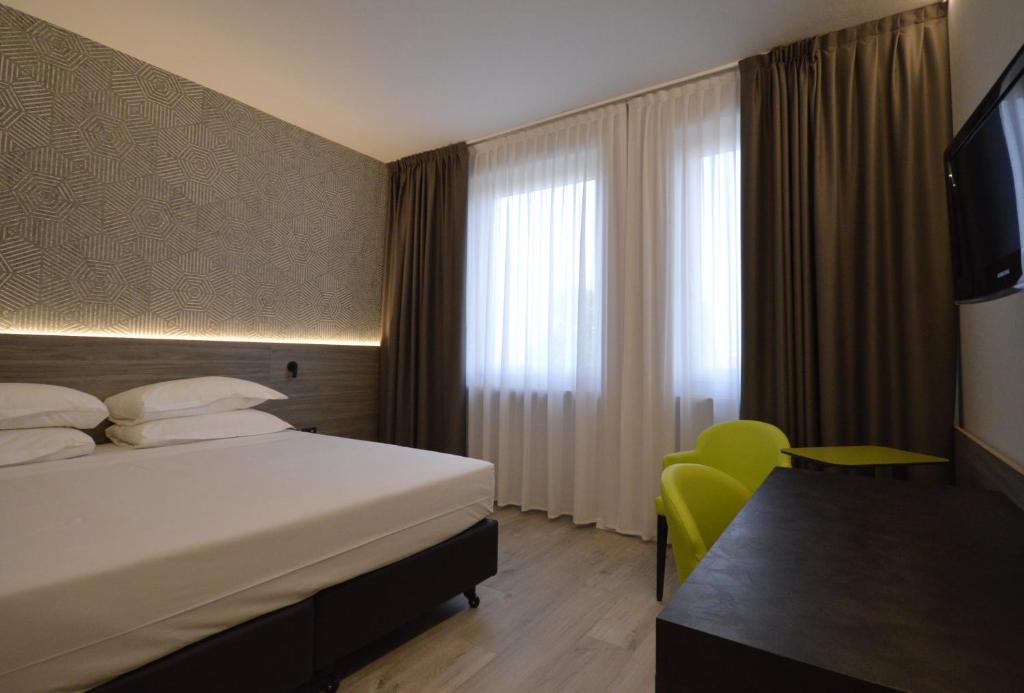 Postel nebo postele na pokoji v ubytování Hotel Friuli