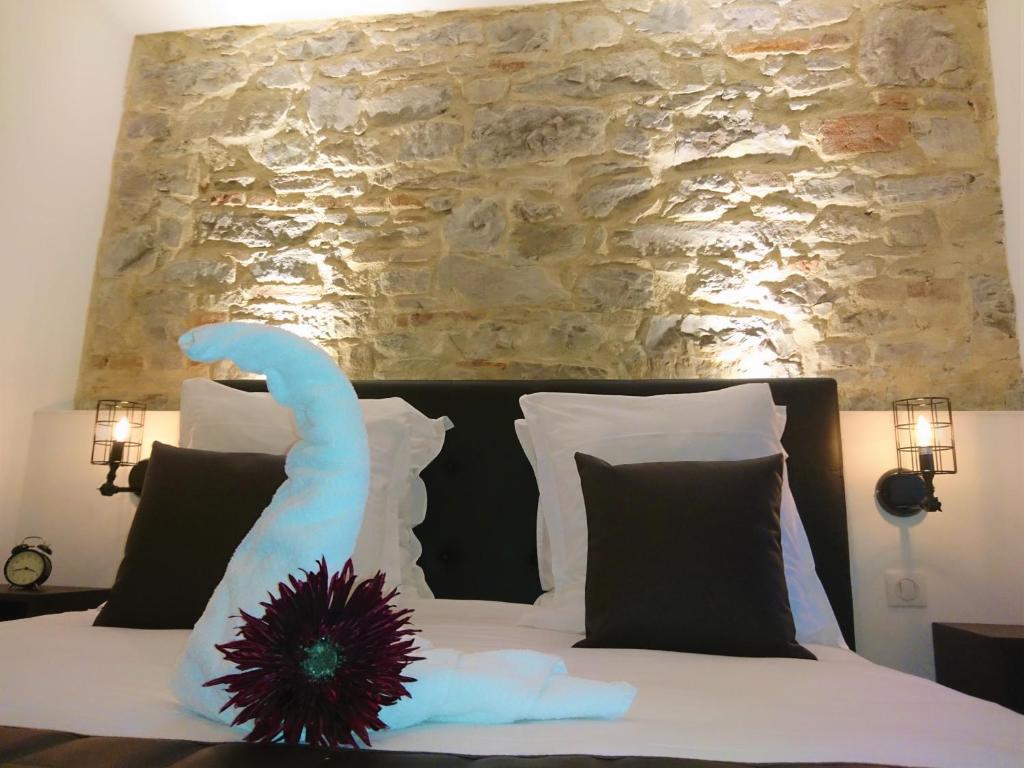 Postel nebo postele na pokoji v ubytování Le Moulin d'Oscar & Spa - Mulhouse Nord