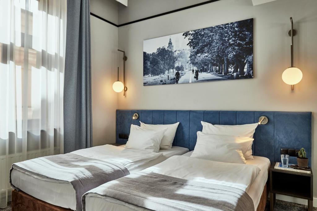 Posteľ alebo postele v izbe v ubytovaní Hotel Unicus Krakow Old Town - Destigo Hotels