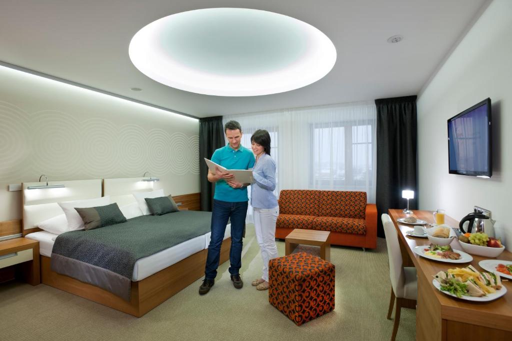 Postel nebo postele na pokoji v ubytování Hotel Vitality