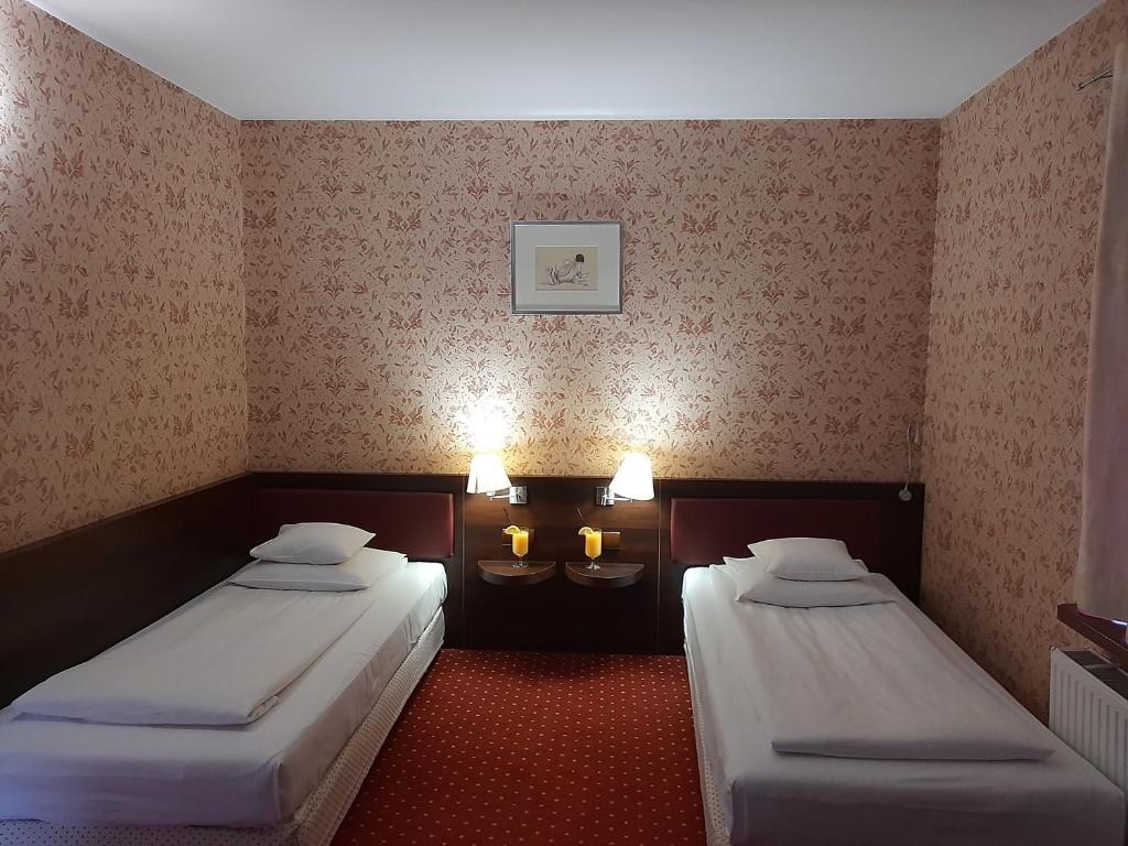 Postel nebo postele na pokoji v ubytování Hotel 1231