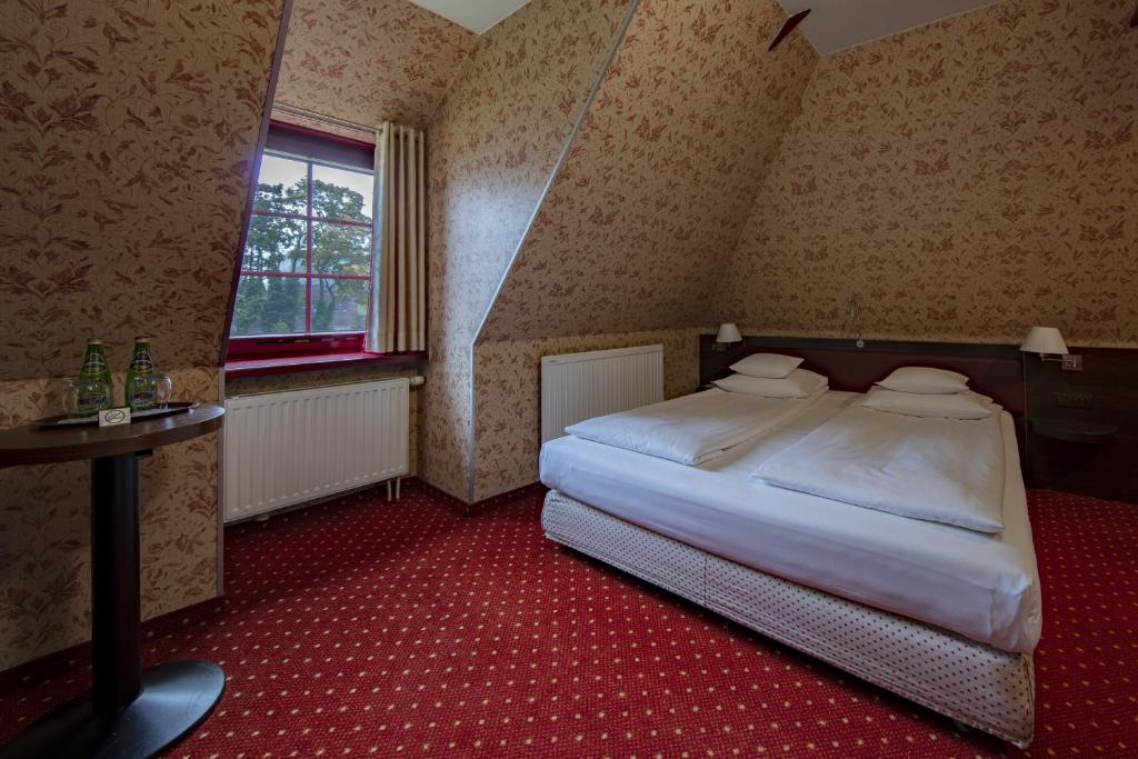 Postel nebo postele na pokoji v ubytování Hotel 1231