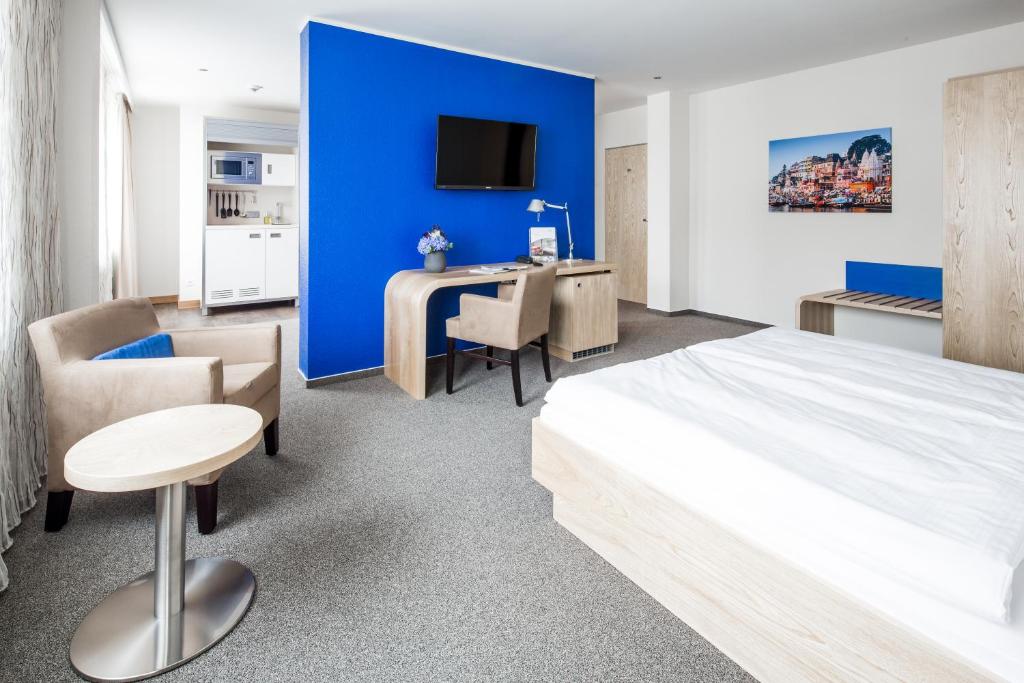 Postel nebo postele na pokoji v ubytování Hotel Global Inn