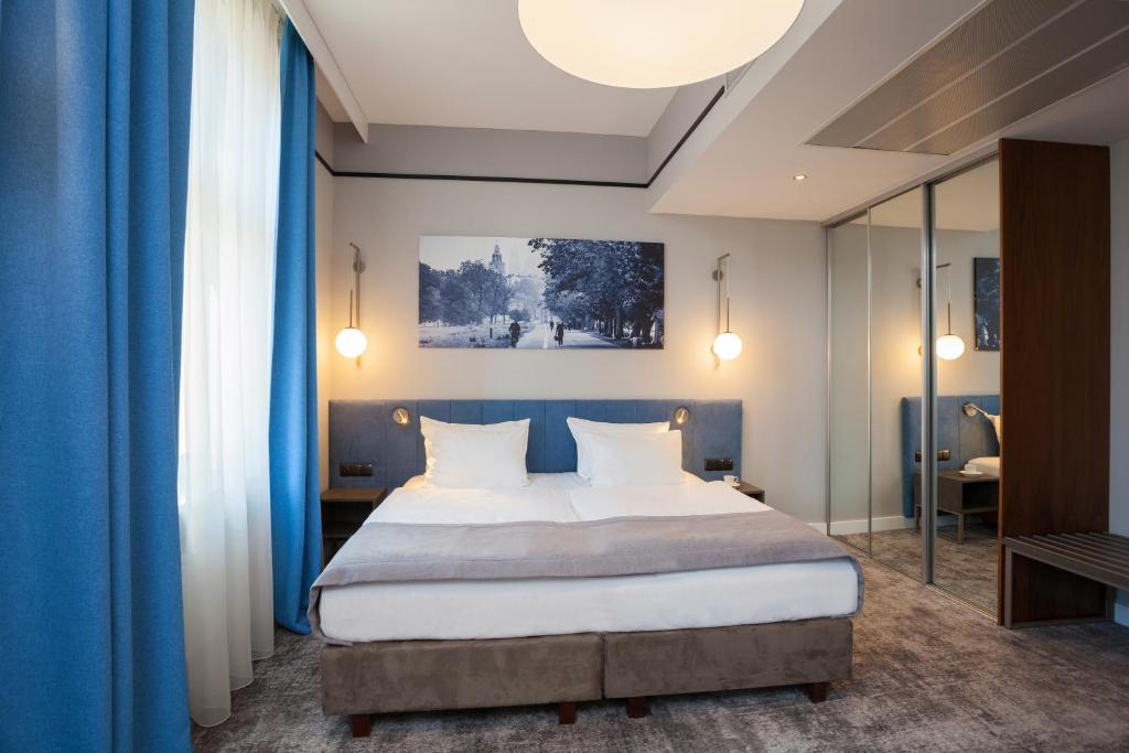 Posteľ alebo postele v izbe v ubytovaní Hotel Unicus Krakow Old Town - Destigo Hotels