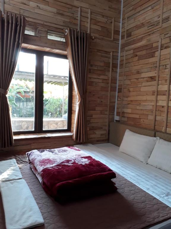 Postel nebo postele na pokoji v ubytování Ha Giang Creekside Homestay and Tours