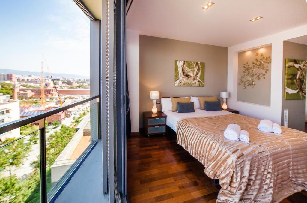 Posteľ alebo postele v izbe v ubytovaní Victoria Diagonal Mar Barcelona