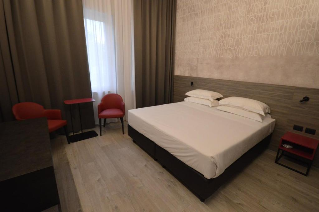 Postel nebo postele na pokoji v ubytování Hotel Friuli