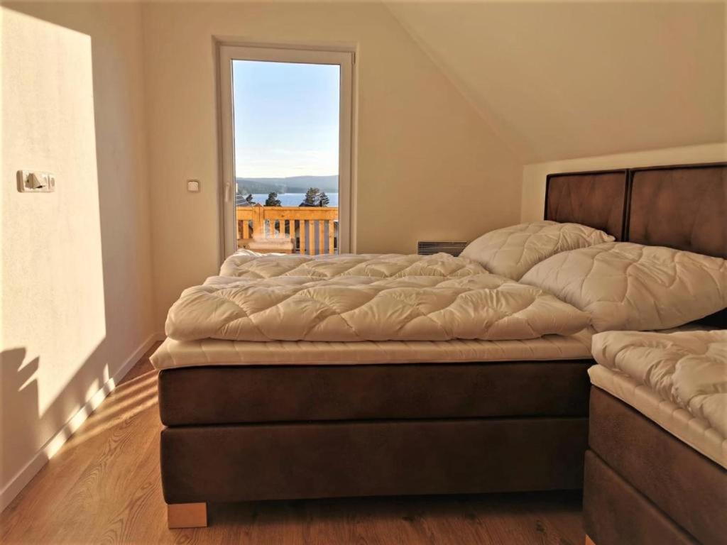 Een bed of bedden in een kamer bij Lipno-Lake