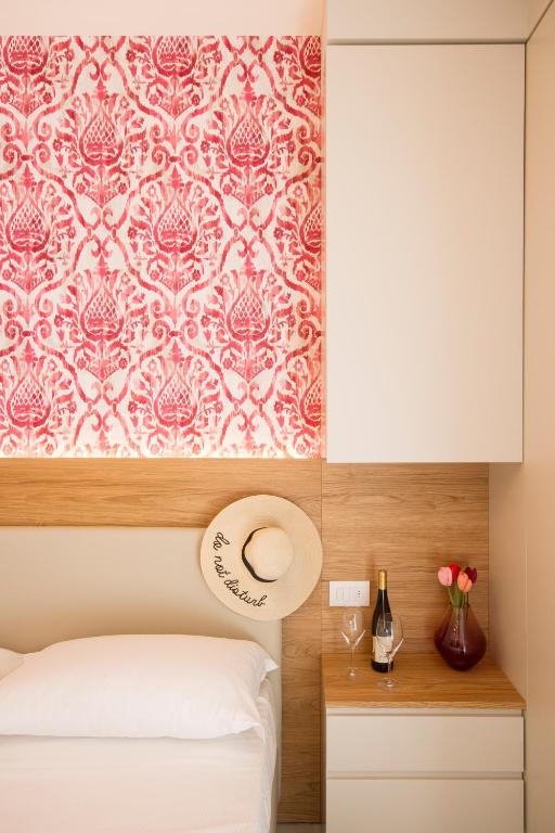 A bed or beds in a room at Hotel Alexandra - Beach Front - Healthy XXL Breakfast & Brunch until 12 30 - parking included