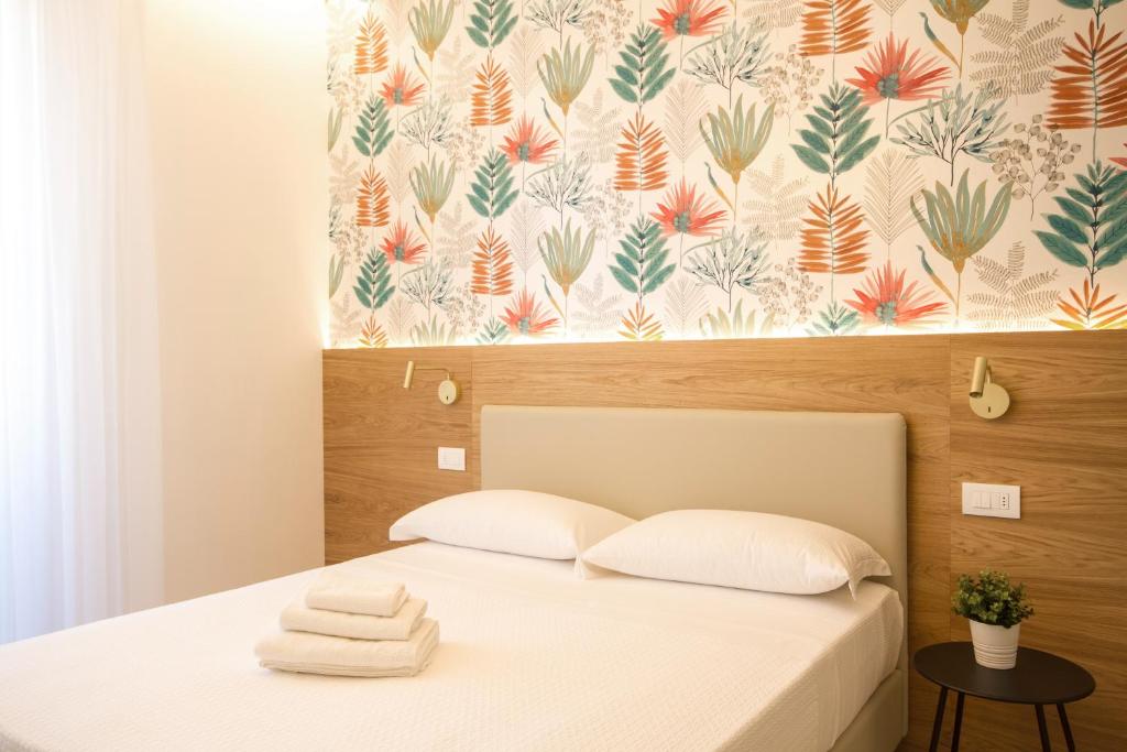 A bed or beds in a room at Hotel Alexandra - Beach Front - Healthy XXL Breakfast & Brunch until 12 30 - parking included