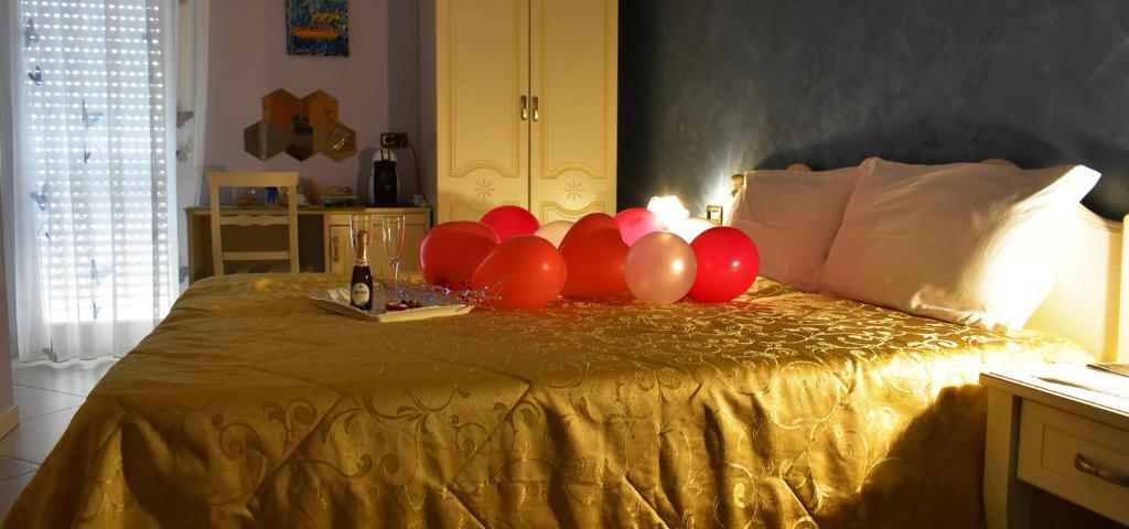 Postel nebo postele na pokoji v ubytování B&B Arcobaleno