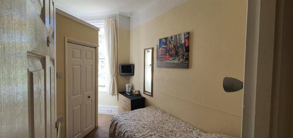 Postel nebo postele na pokoji v ubytování sunnylodge
