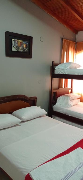 Cama o camas de una habitación en Hotel Los Estoraques
