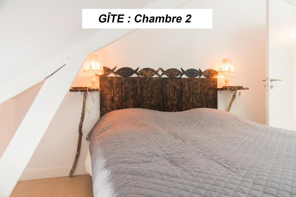 Postel nebo postele na pokoji v ubytování chambre d'hôte et gîte du jardin des corsaires