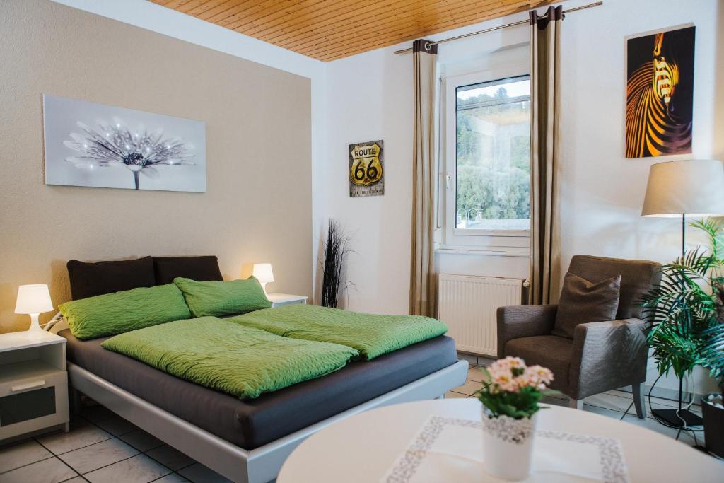 a bedroom with a bed and a table at Rhein-Camping Waldshut in Waldshut-Tiengen