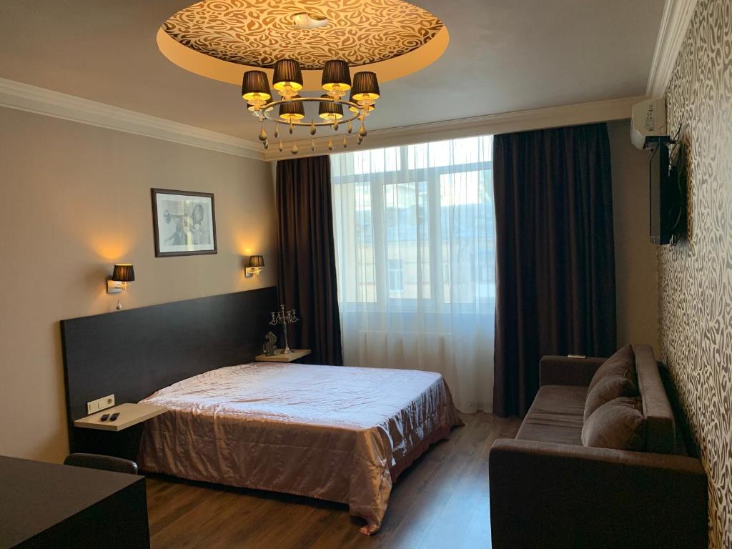 Кровать или кровати в номере Apartment Elegant