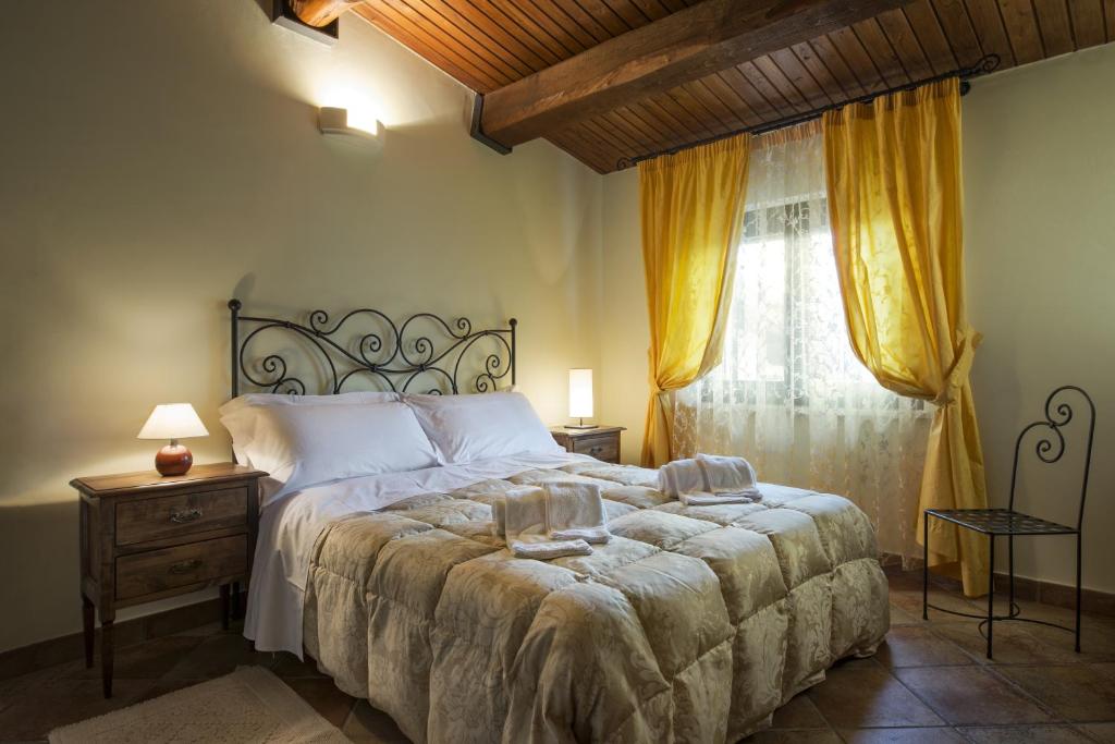 Postel nebo postele na pokoji v ubytování Torre di Cordaglie