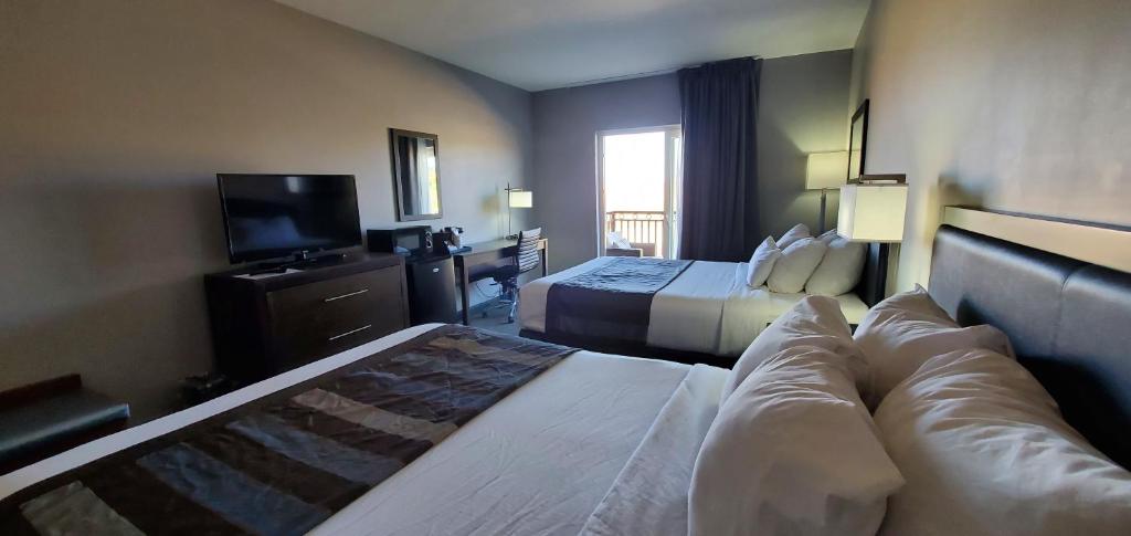 Ein Bett oder Betten in einem Zimmer der Unterkunft Wingate by Wyndham Page Lake Powell