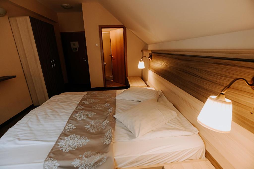 Postel nebo postele na pokoji v ubytování Guest house Lacul Linistit