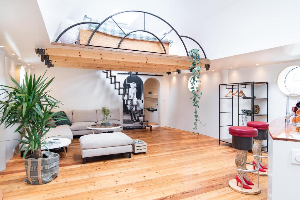 a living room with a loft bed at B&B Houseboat Amsterdam in Amsterdam