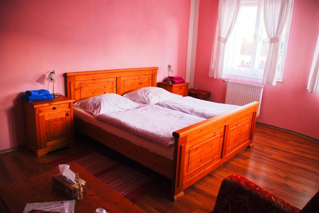 Postel nebo postele na pokoji v ubytování Hostinec a penzion U Rezků