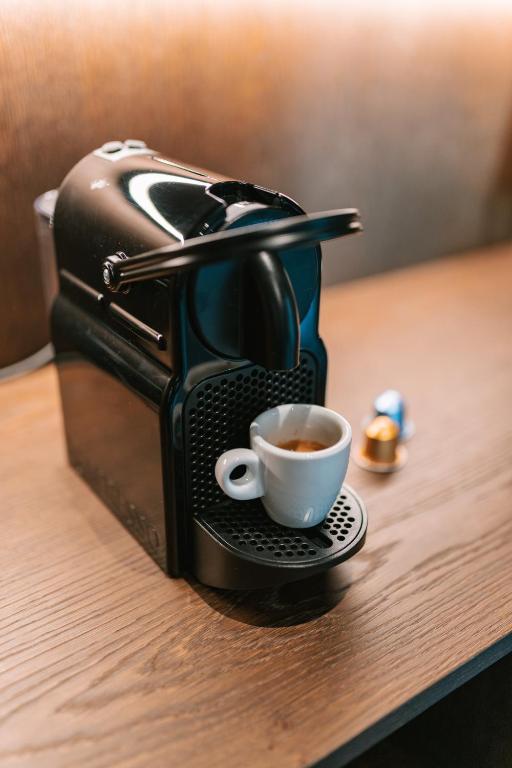 Coffee and tea making facilities at Floris Green Suites by Parc Hotel Florian