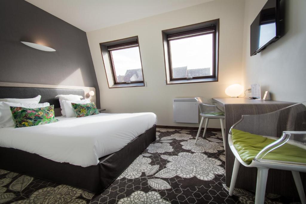 Postel nebo postele na pokoji v ubytování Hôtel Restaurant Vaillant proche Europapark Rulantica
