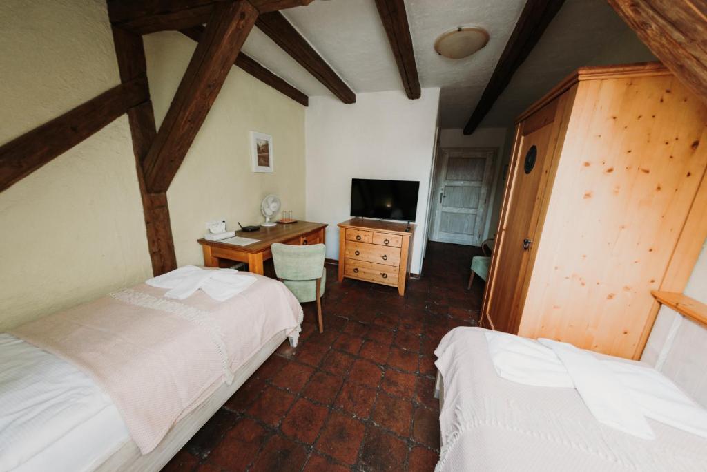 Postel nebo postele na pokoji v ubytování Hotel U Hrabenky