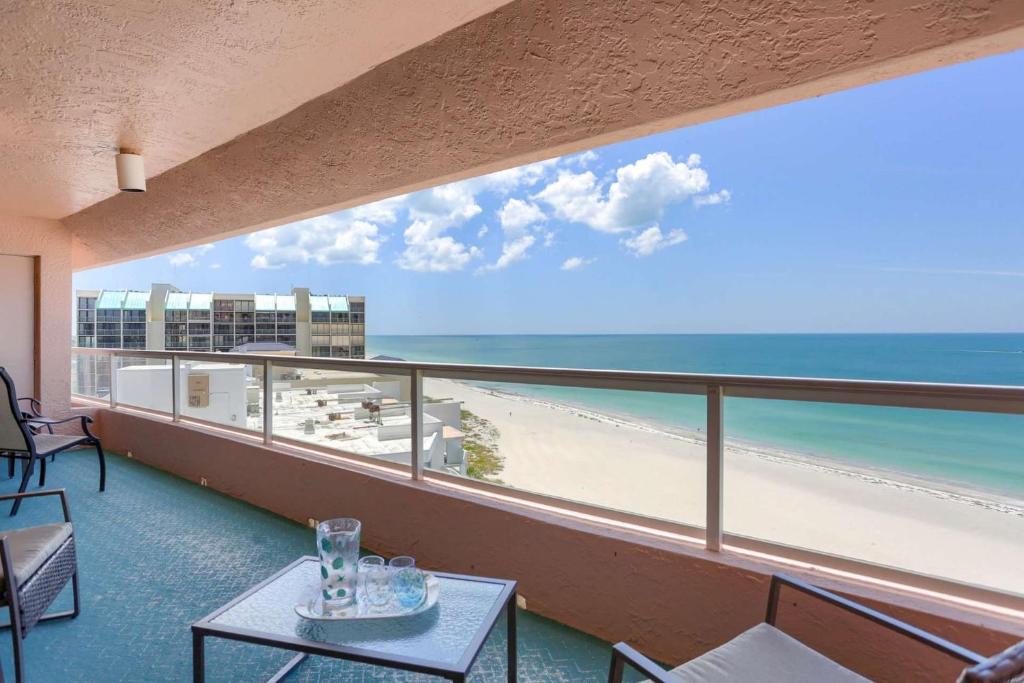 a balcony with a view of the beach and the ocean at 12B Crescent Beach Club in Clearwater Beach