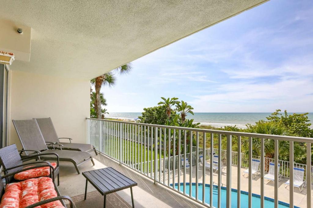 a balcony with a view of the beach at 104 Hamilton House in Clearwater Beach