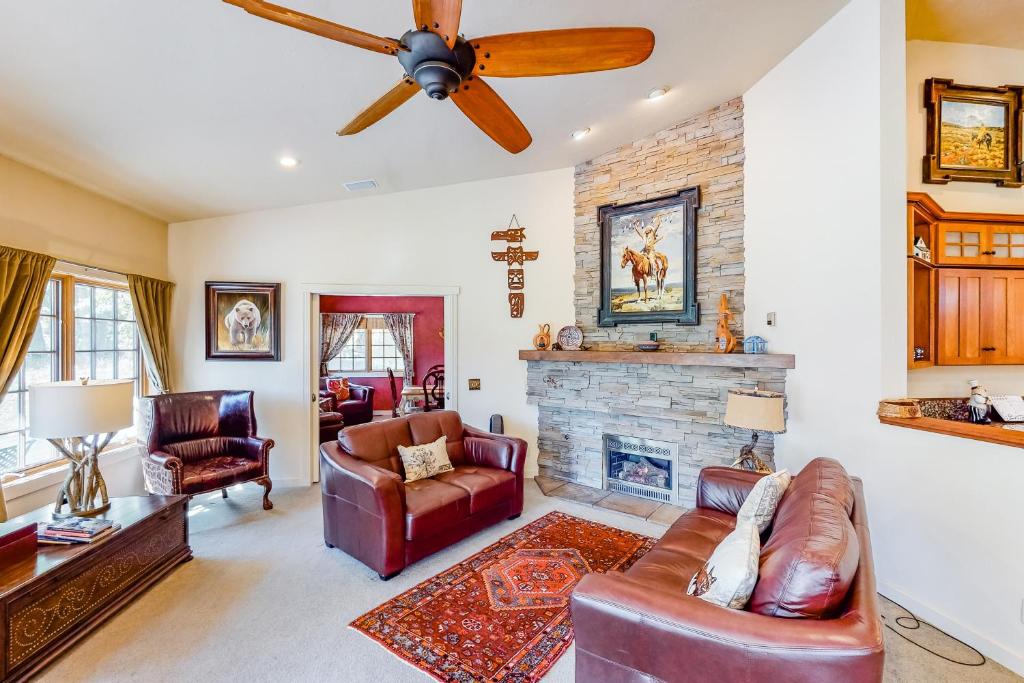 a living room with a couch and a fireplace at Riverside Bliss in Bellevue