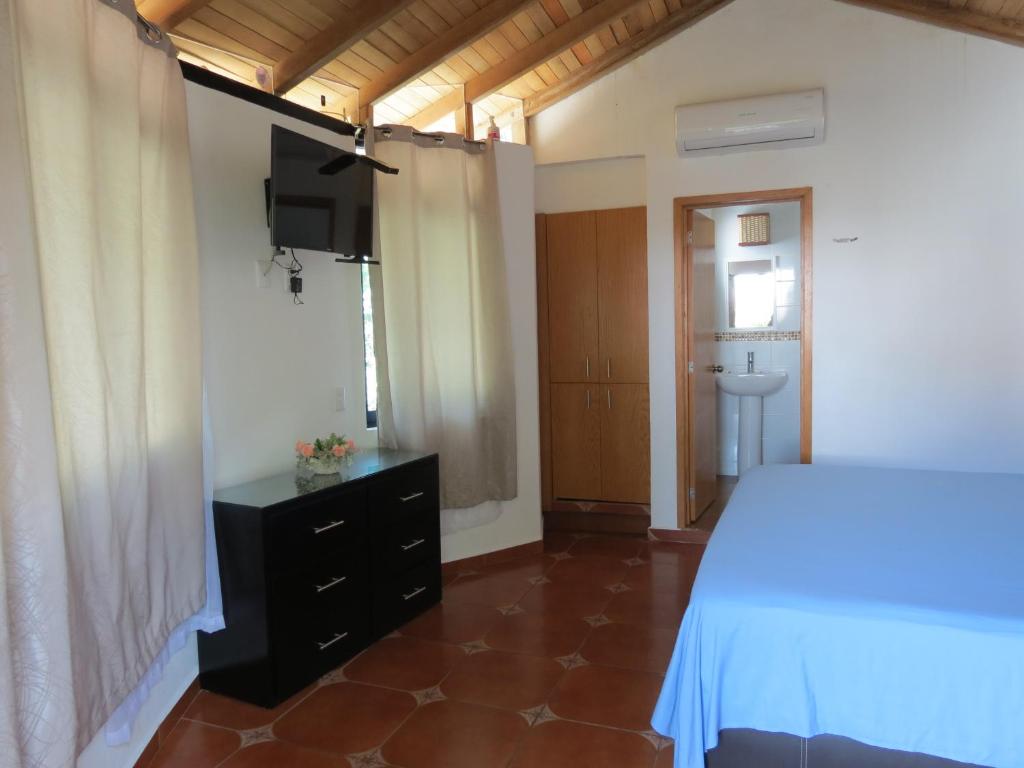 Postel nebo postele na pokoji v ubytování Hotel Posada Comala