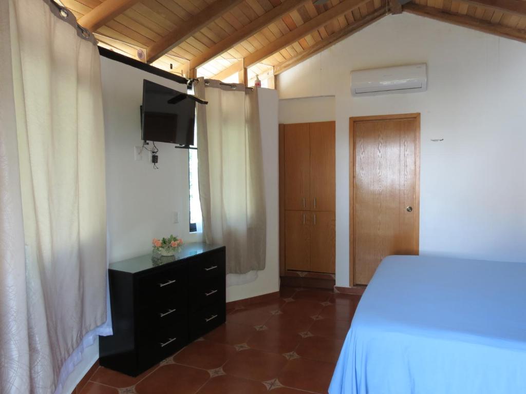 Postel nebo postele na pokoji v ubytování Hotel Posada Comala