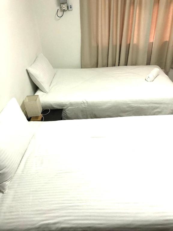 Postel nebo postele na pokoji v ubytování Kerteh Apartment