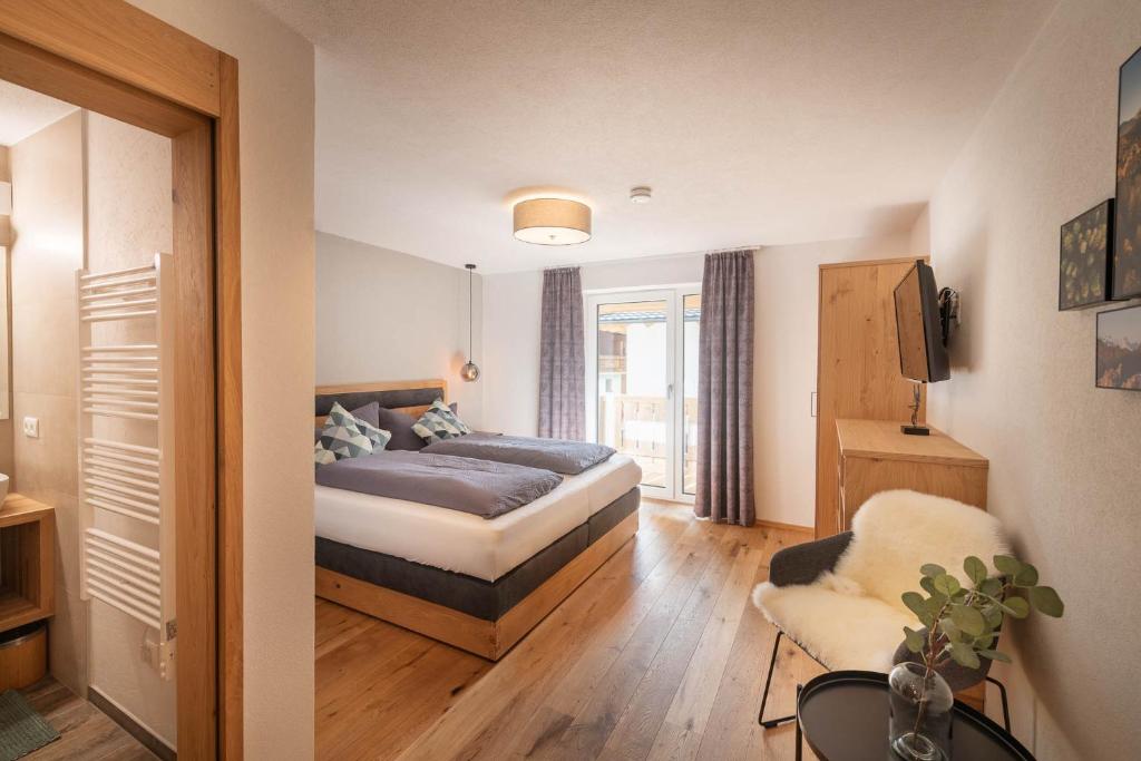 Postel nebo postele na pokoji v ubytování Appartements Seven Summits