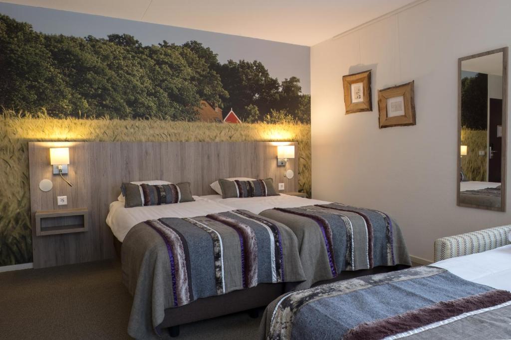 Postel nebo postele na pokoji v ubytování Landgoedhotel Woodbrooke Barchem