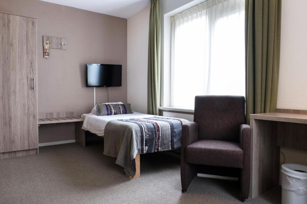 Postel nebo postele na pokoji v ubytování Landgoedhotel Woodbrooke Barchem