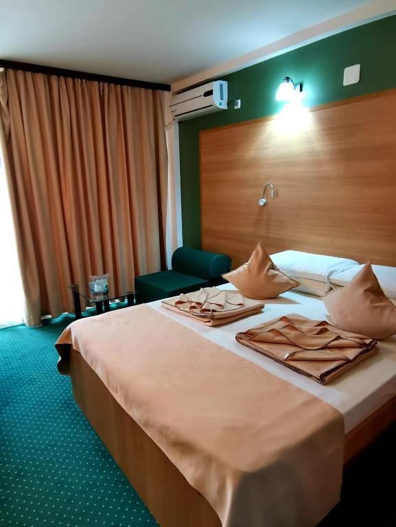 Postel nebo postele na pokoji v ubytování Delta Palace