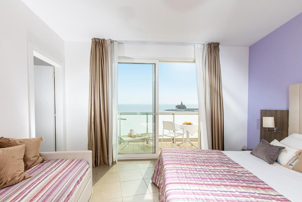 Postel nebo postele na pokoji v ubytování Hotel Karinzia