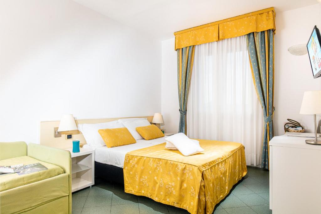 Postel nebo postele na pokoji v ubytování Hotel Karinzia