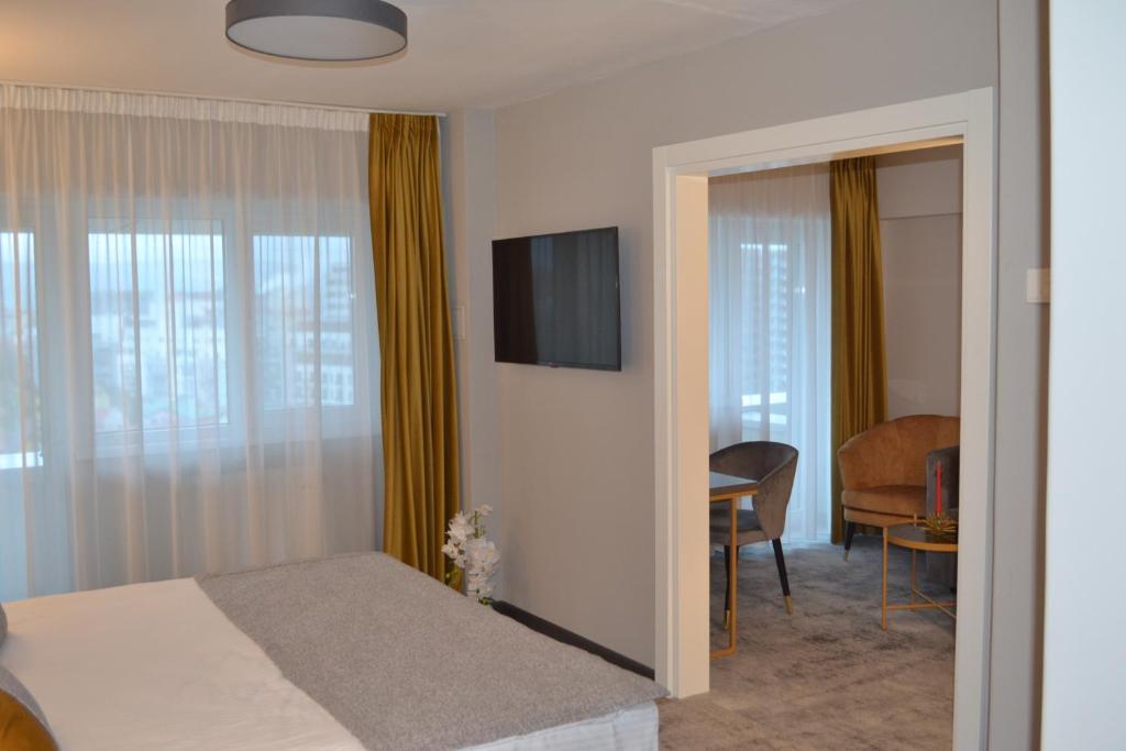 TV a/nebo společenská místnost v ubytování Hotel Univers