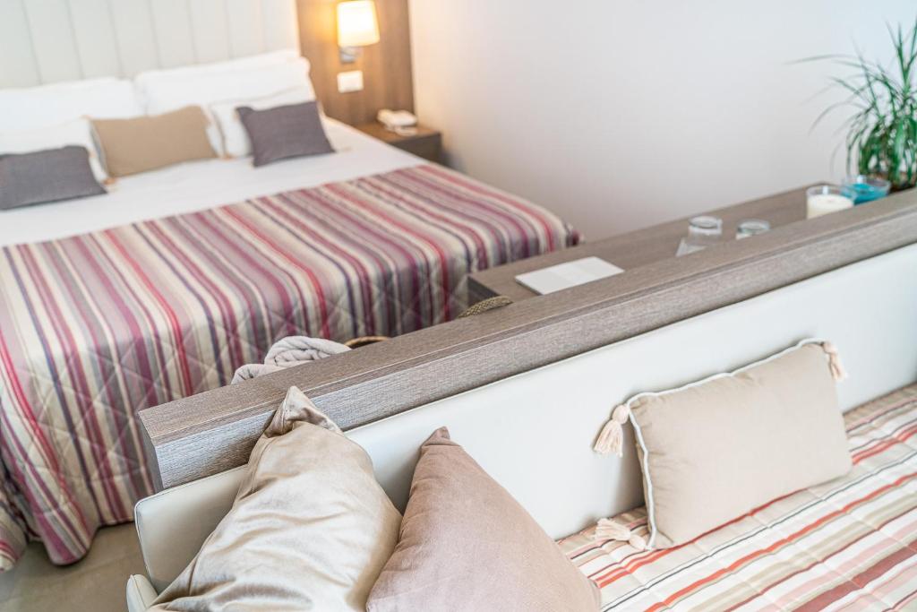 Postel nebo postele na pokoji v ubytování Hotel Karinzia