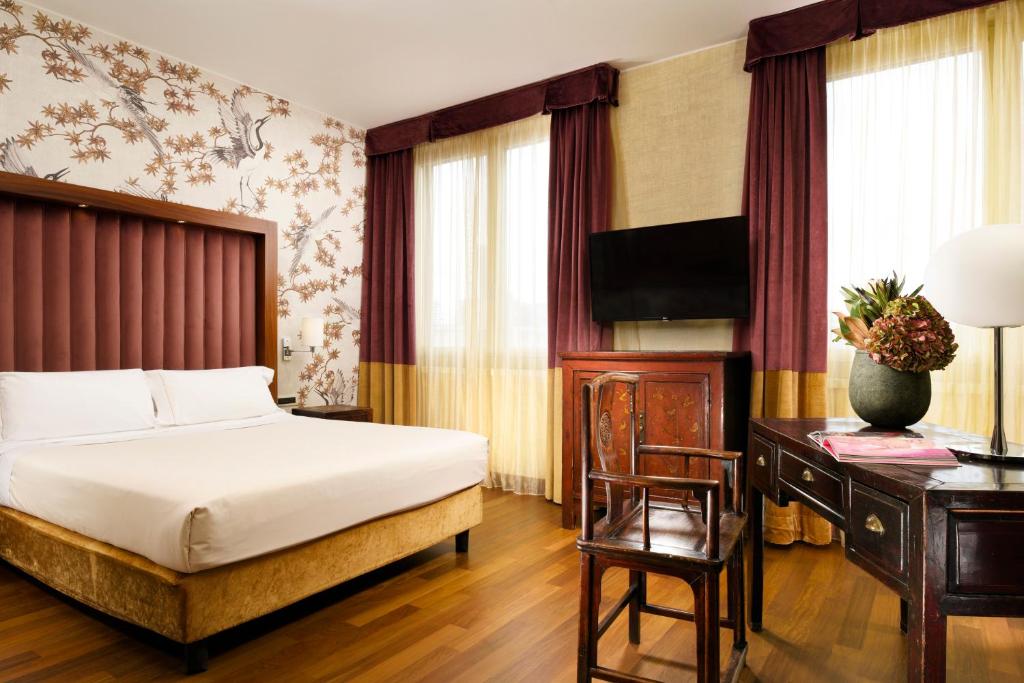 Postel nebo postele na pokoji v ubytování Enterprise Hotel Design & Boutique