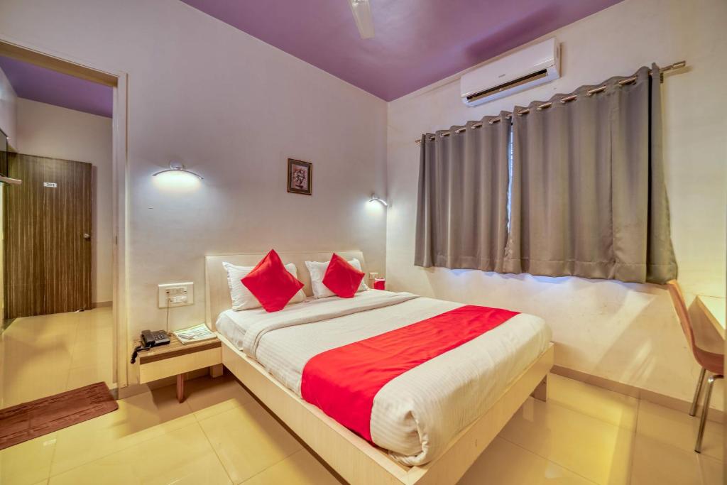Postel nebo postele na pokoji v ubytování Hotel Grand Ashwin