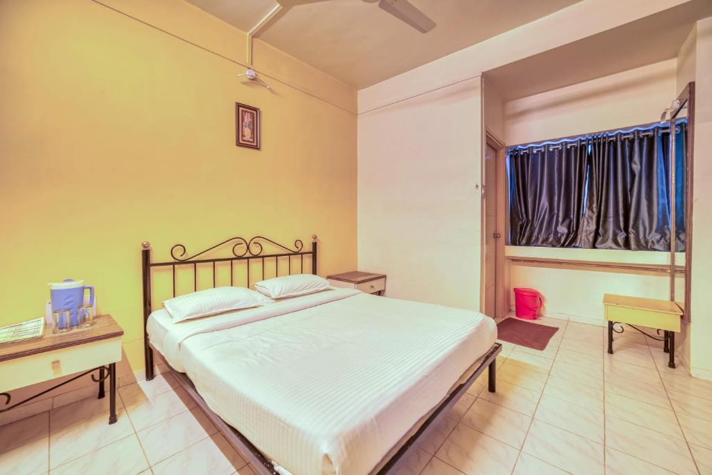 Postel nebo postele na pokoji v ubytování Hotel Grand Ashwin