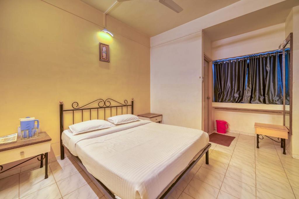 Postel nebo postele na pokoji v ubytování Hotel Grand Ashwin