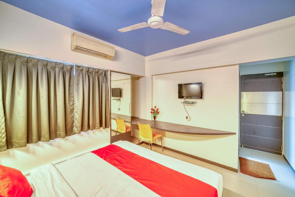 Postel nebo postele na pokoji v ubytování Hotel Grand Ashwin