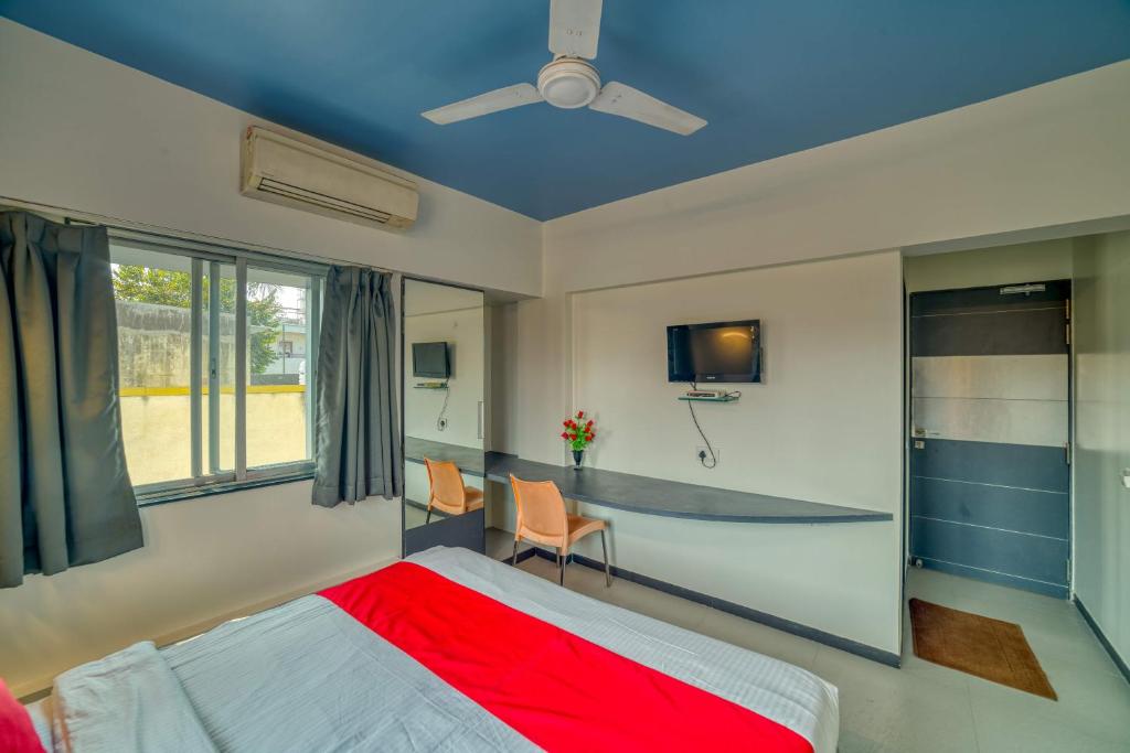 Postel nebo postele na pokoji v ubytování Hotel Grand Ashwin