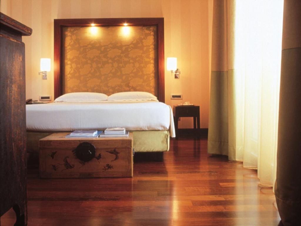 Postel nebo postele na pokoji v ubytování Enterprise Hotel Design & Boutique