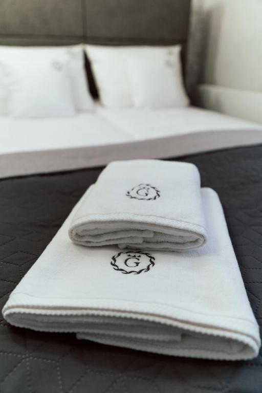 Postel nebo postele na pokoji v ubytování Hotel Grey Spa